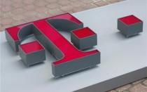 T-Mobile logo is ready to be placed on a former Era Mobile outlet in Warsaw
