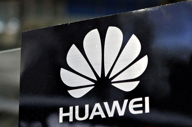 File photo of a Huawei logo seen above the company's pavilion during the CommunicAsia trade show in Singapore